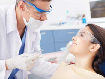 Young woman visiting dentist